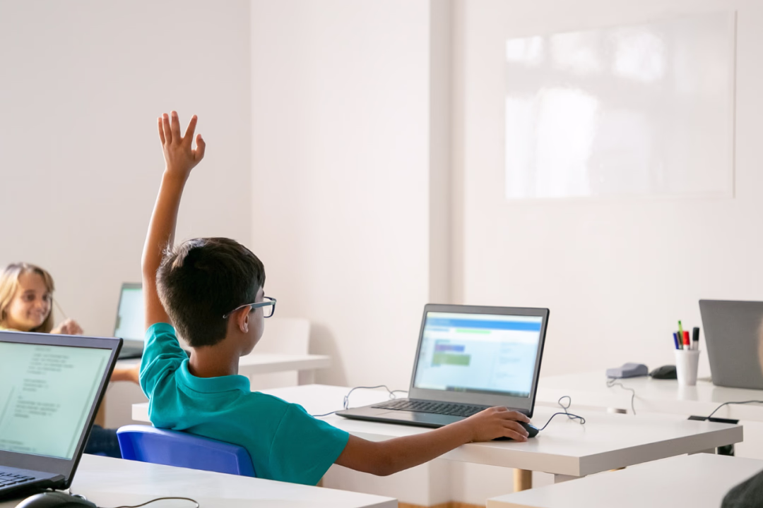Students giving digital presentations in the classroom
